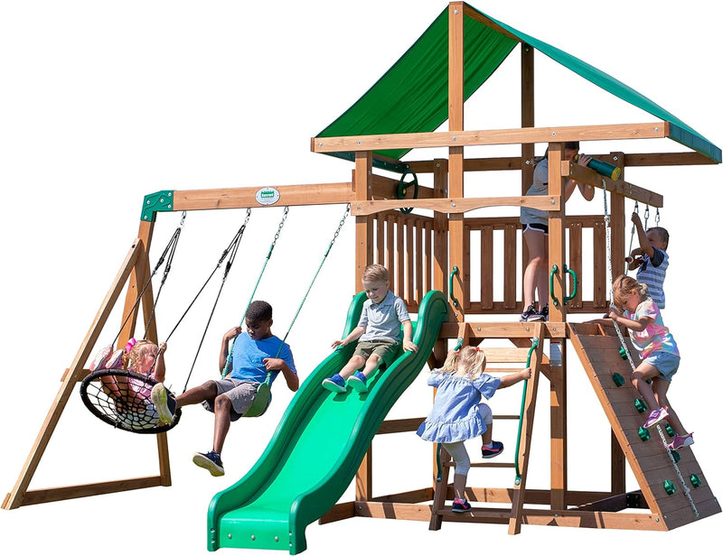 A complete set of wooden mountain-style swings, equipped with a colorful canvas sunshade, a wave slide, a rope swing, a net swing, and a rock wall with climbing ropes and ladders. Z0